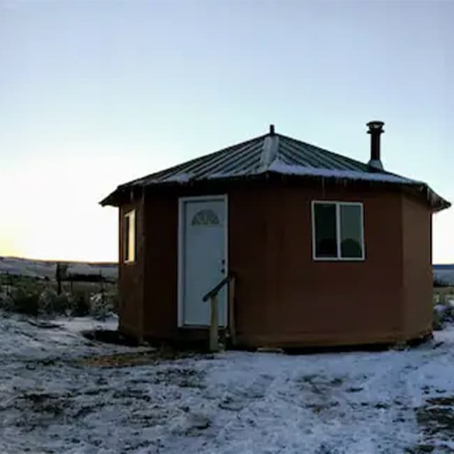 The roof of a hard-sided yurt near Capulin, Colorado, is dusted with snow as the sun brightens up the sky.