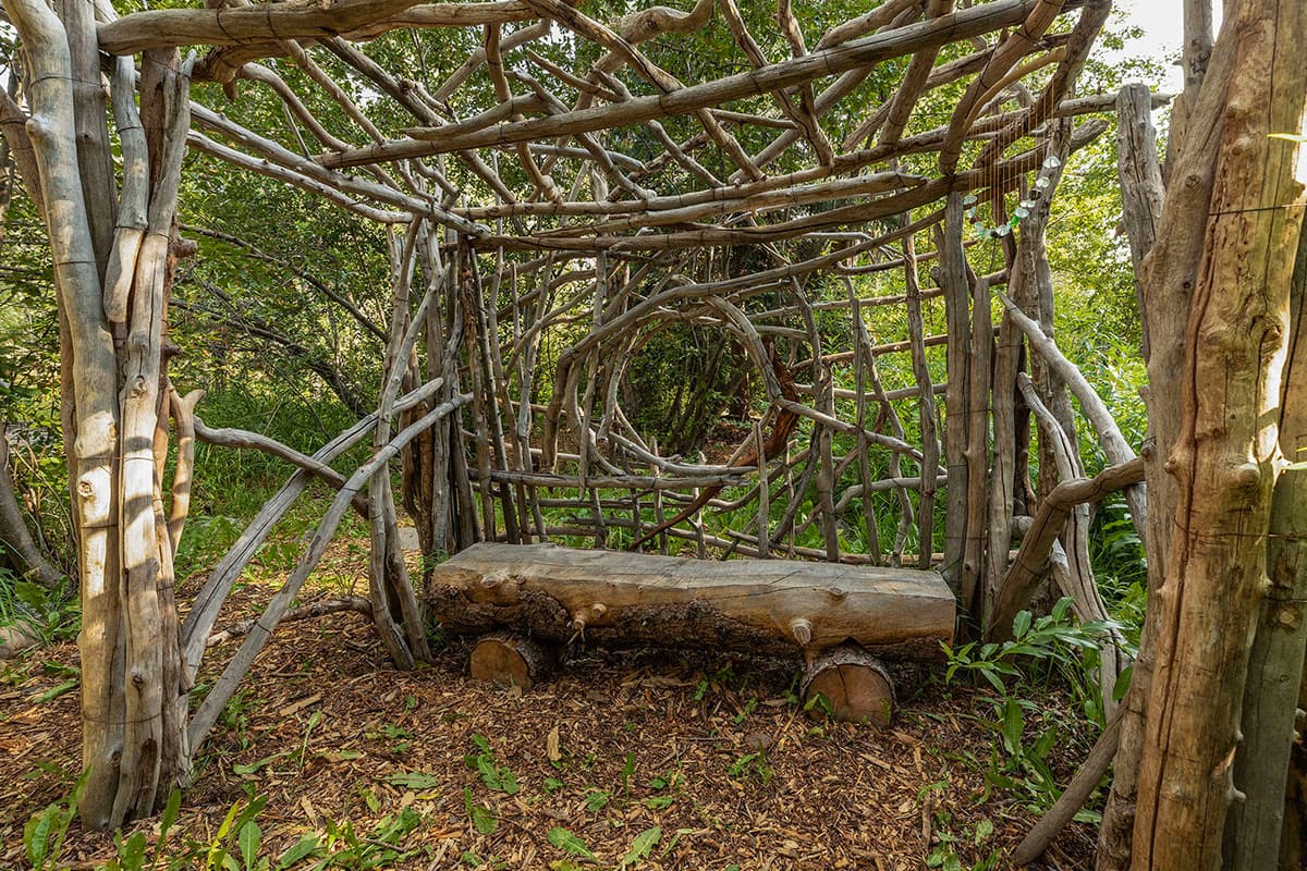A rustic, log-style bench awaits visitors at O-Bar-O Cabins near Durango, CO.