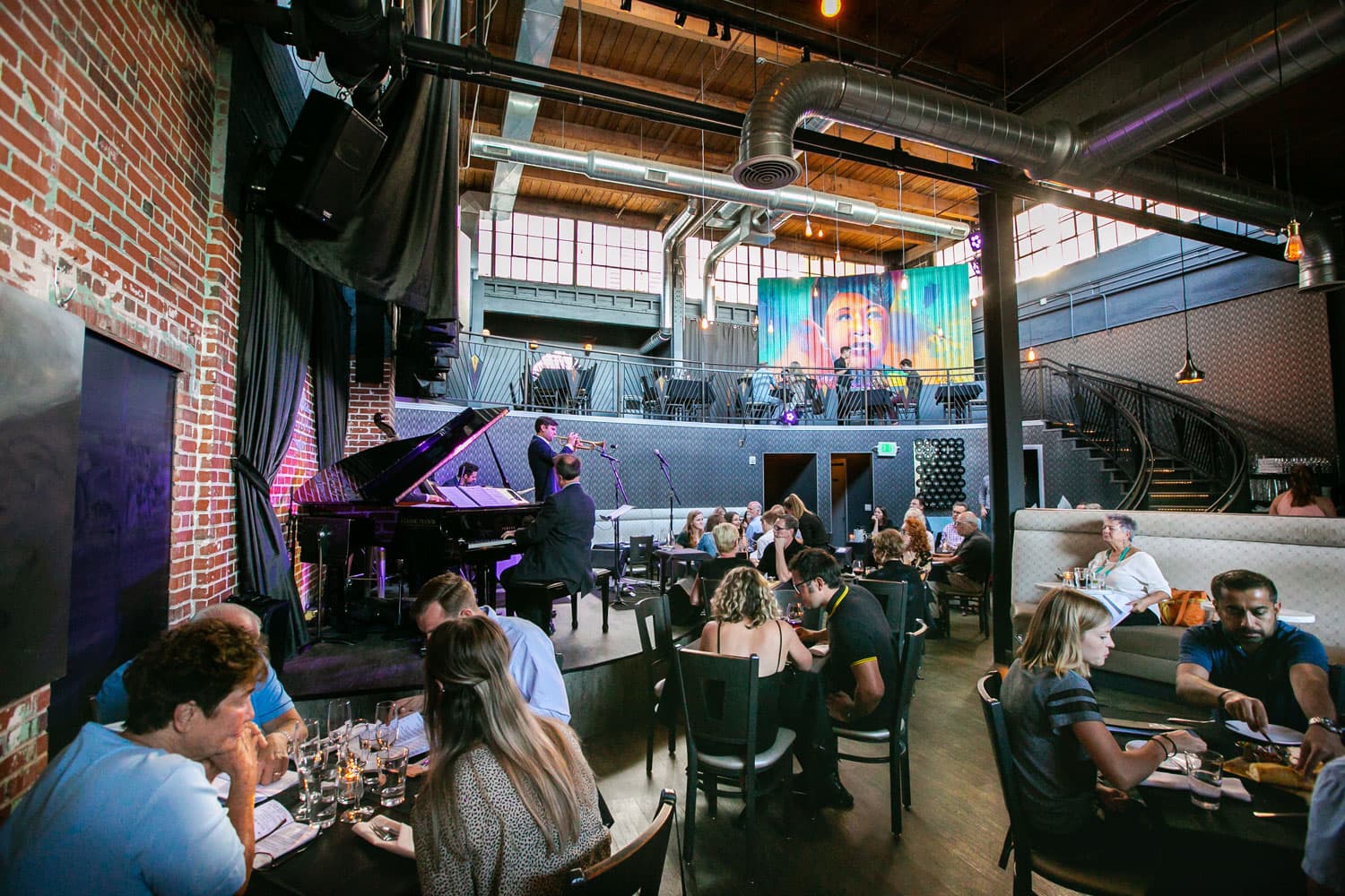 Live music is played inside a restaurant full of diners