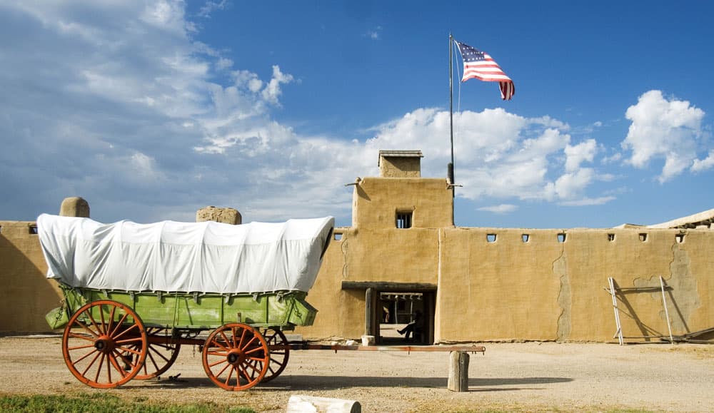 A chuck wagon sits in front of Bent's Old Fort National Historic Site near La Junta, CO