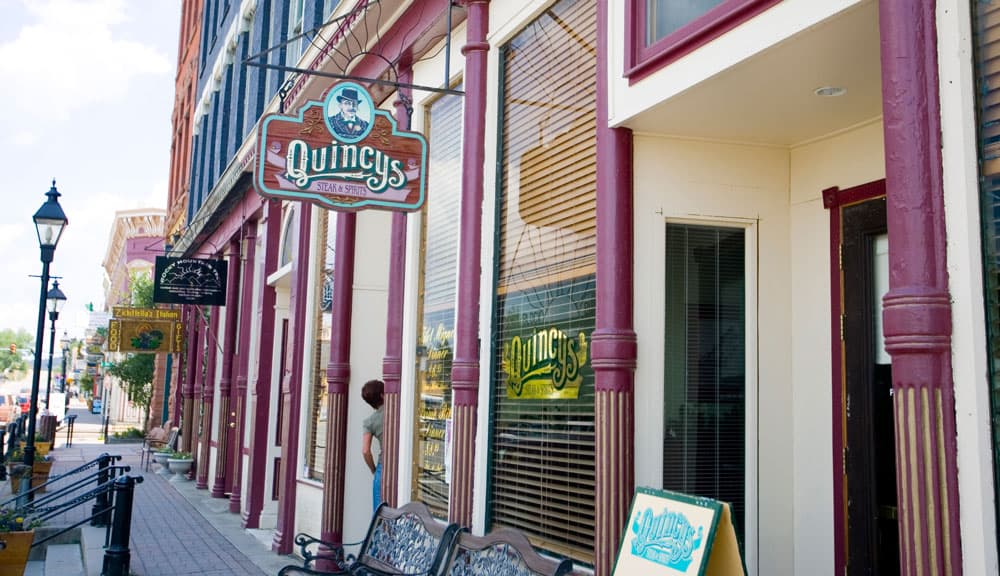 Colorful storefronts along the street in a mountain town
