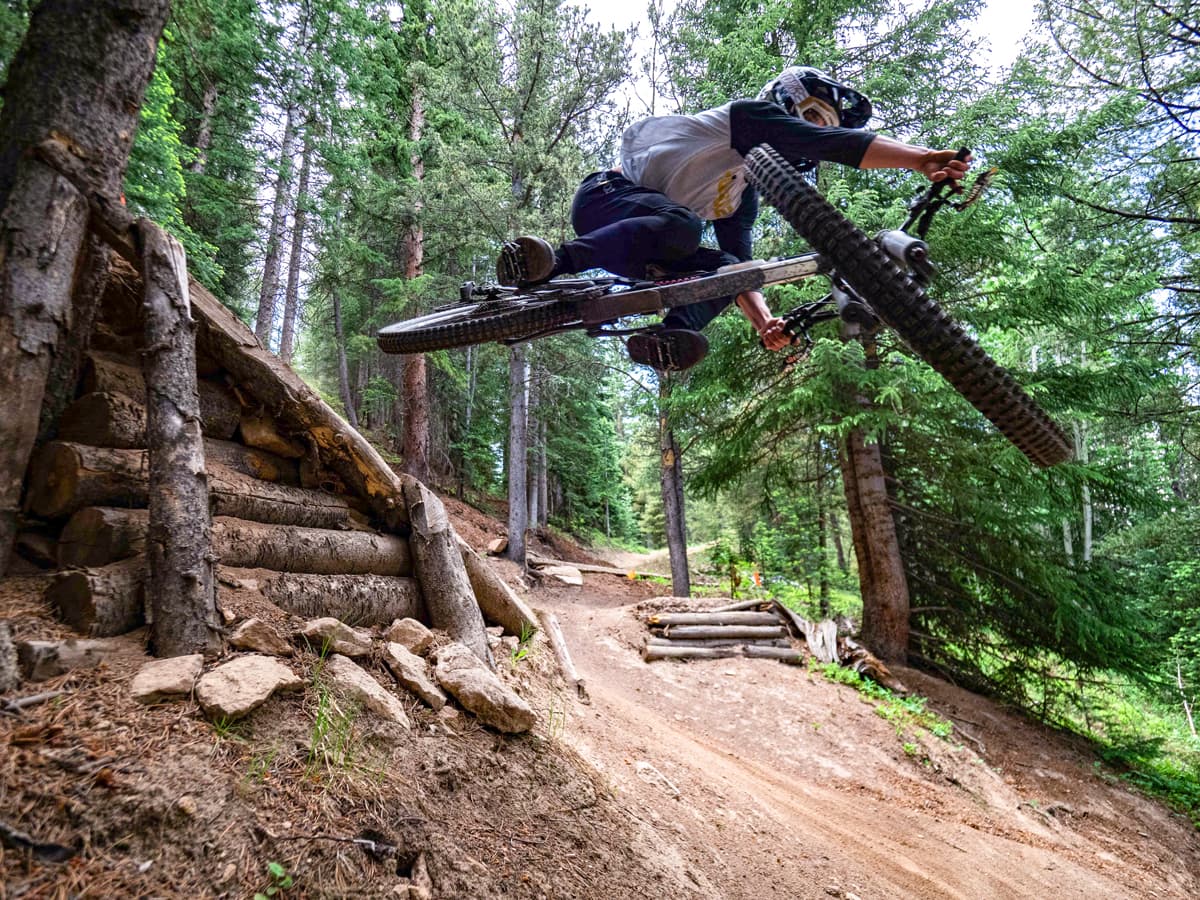 A rider catches air at Crested Butte Mountain Bike Park.
