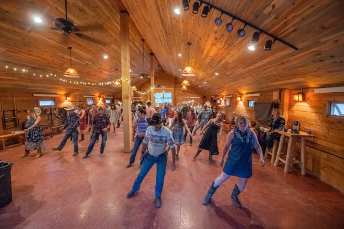 lively crowd barn dancing at Vista Verde Ranch in Colorado
