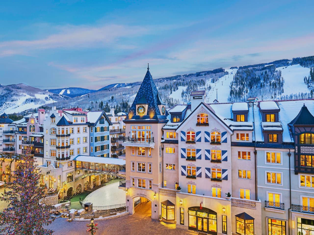 A snowcovered hotel in Vail at dusk