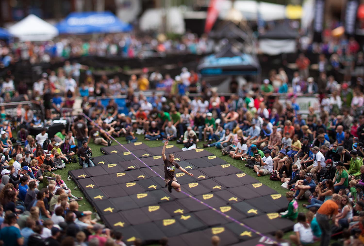 A person balances on a slack line at the GoPro Mountain Games in Vail, Colorado