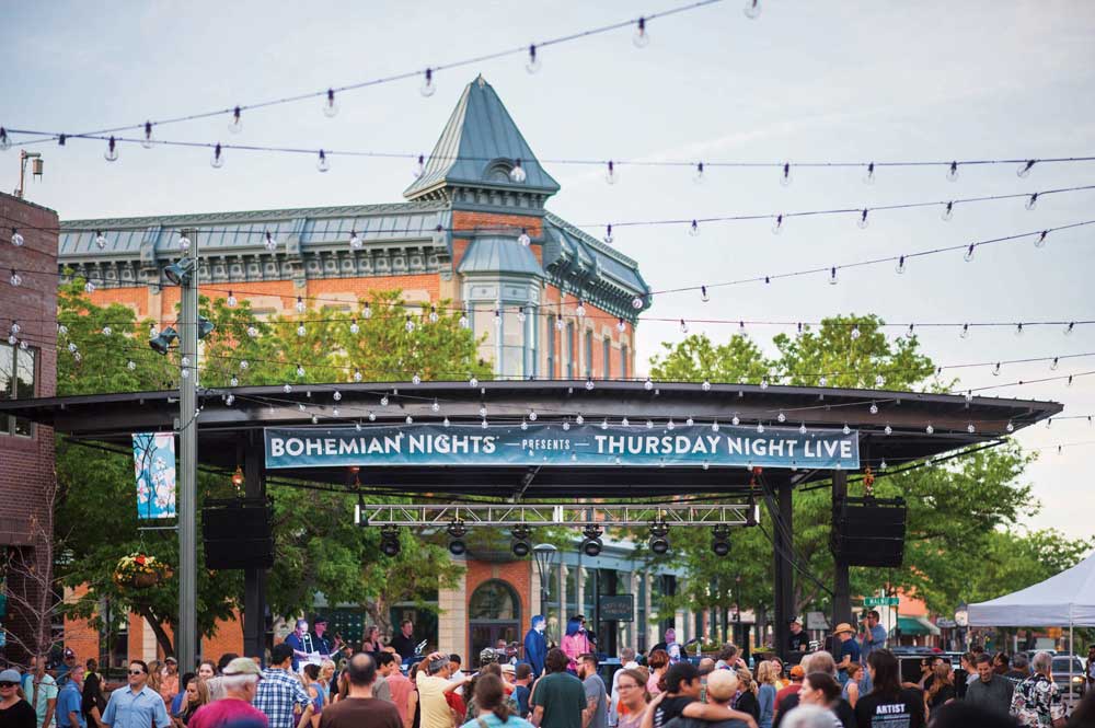 String lights over people by the stage during Bohemian Nights Thursday Night Live in Fort Collins
