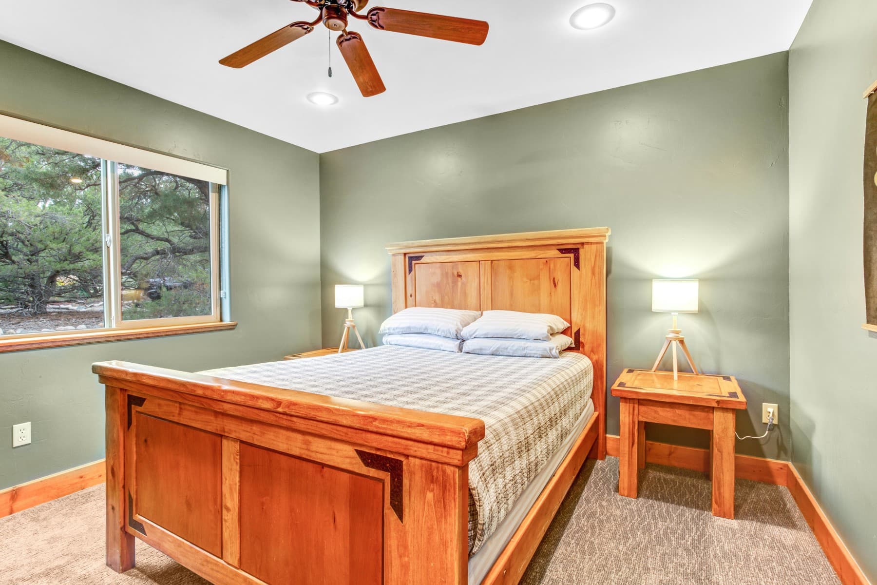 each of our luxury cabins features a private main floor bedroom, pictured. there are two additional beds in the upstairs loft. photo 9