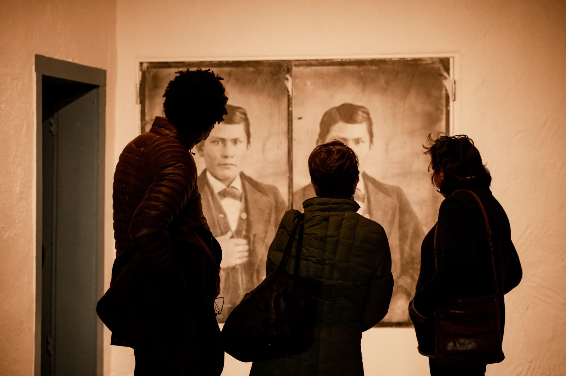 museumgoers view artwork at fort garland museum & cultural center photo 2