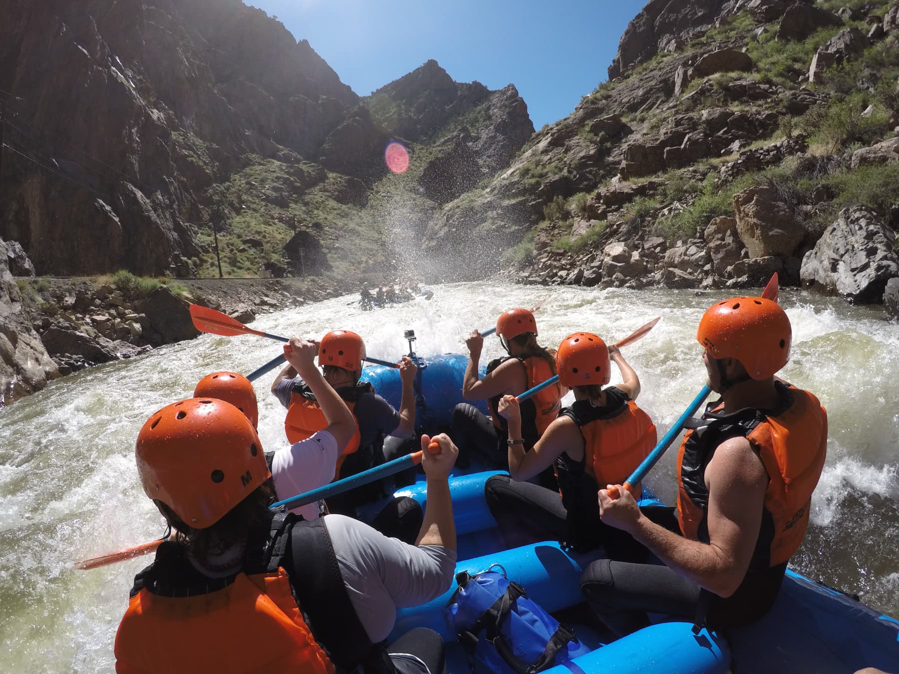 a crew of echo canyon rafters paddle through sunshine rapid in the royal gorge photo 6