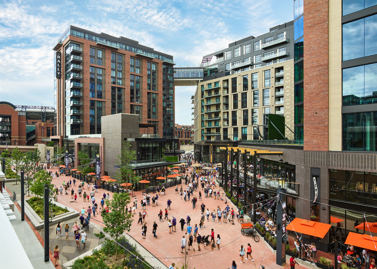 McGregor Square bustles with restaurants, shops, a hotel, pedestrians and more on a sunny day
