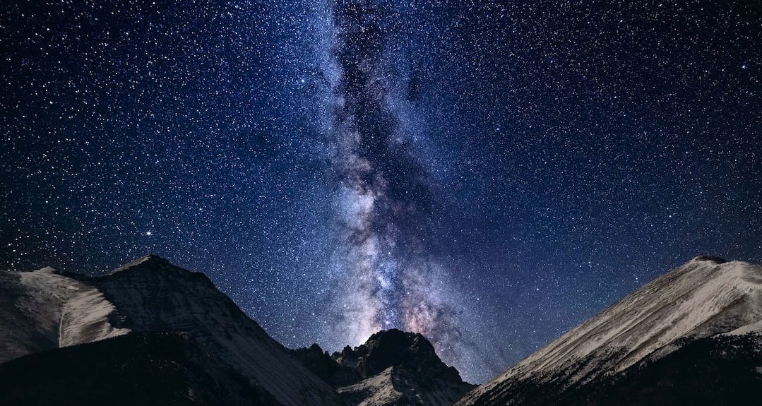 The Milky Way against a dark night sky over the Crestone Needles formation