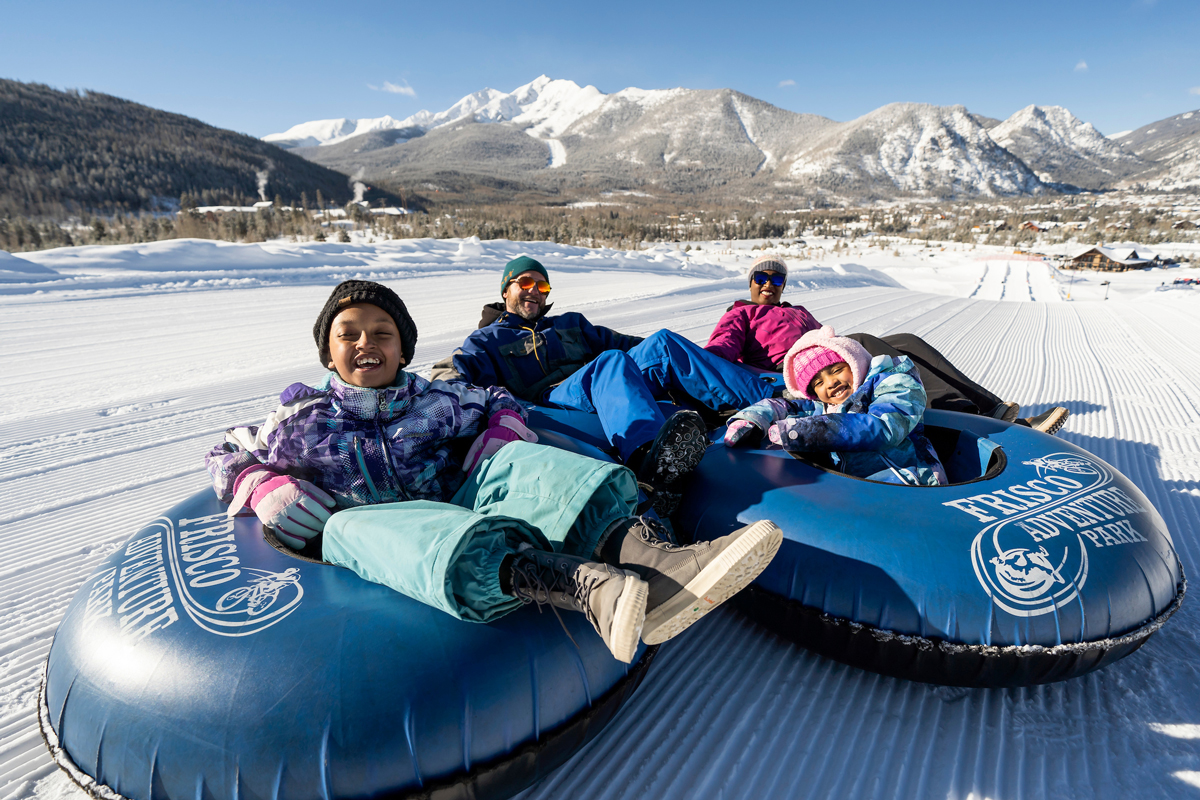 People riding in snow tubes at Frisco Adventure Park in Frisco, Colorado