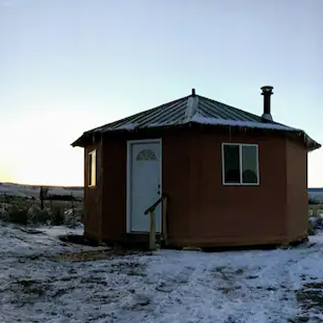 The roof of a hard-sided yurt near Capulin, Colorado, is dusted with snow as the sun brightens up the sky.