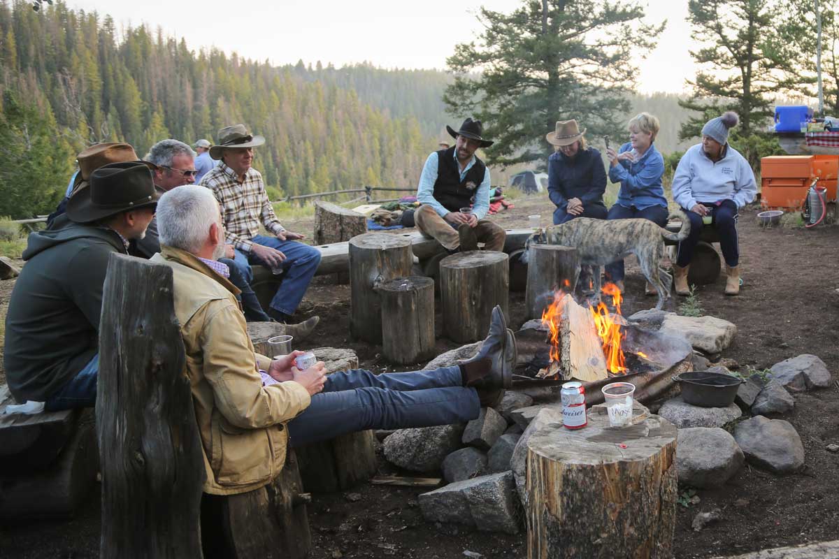 Black Mountain Ranch guests gather for a meal outside after a day of fun