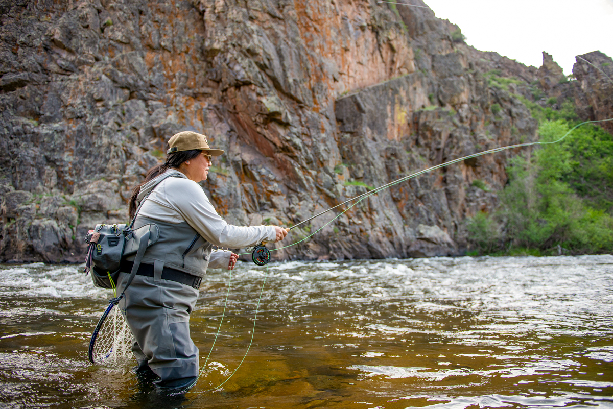 A person fly-fishes in a canyon in the  Gold Medal waters of the Gunnison and Taylor Rivers in Gunnison and Crested Butte Colorado
