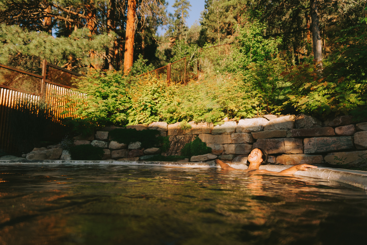 A person in a hot-springs pool leans back and relaxes at Relaxing with a soak at durango hot springs in Colorado