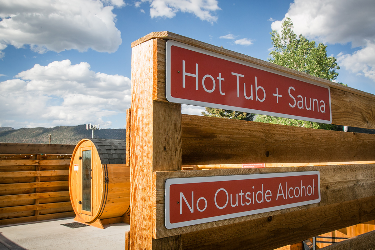 A round, barrel-like sauna stands outside LOGE Wolf Creek near South Fork, Colorado.