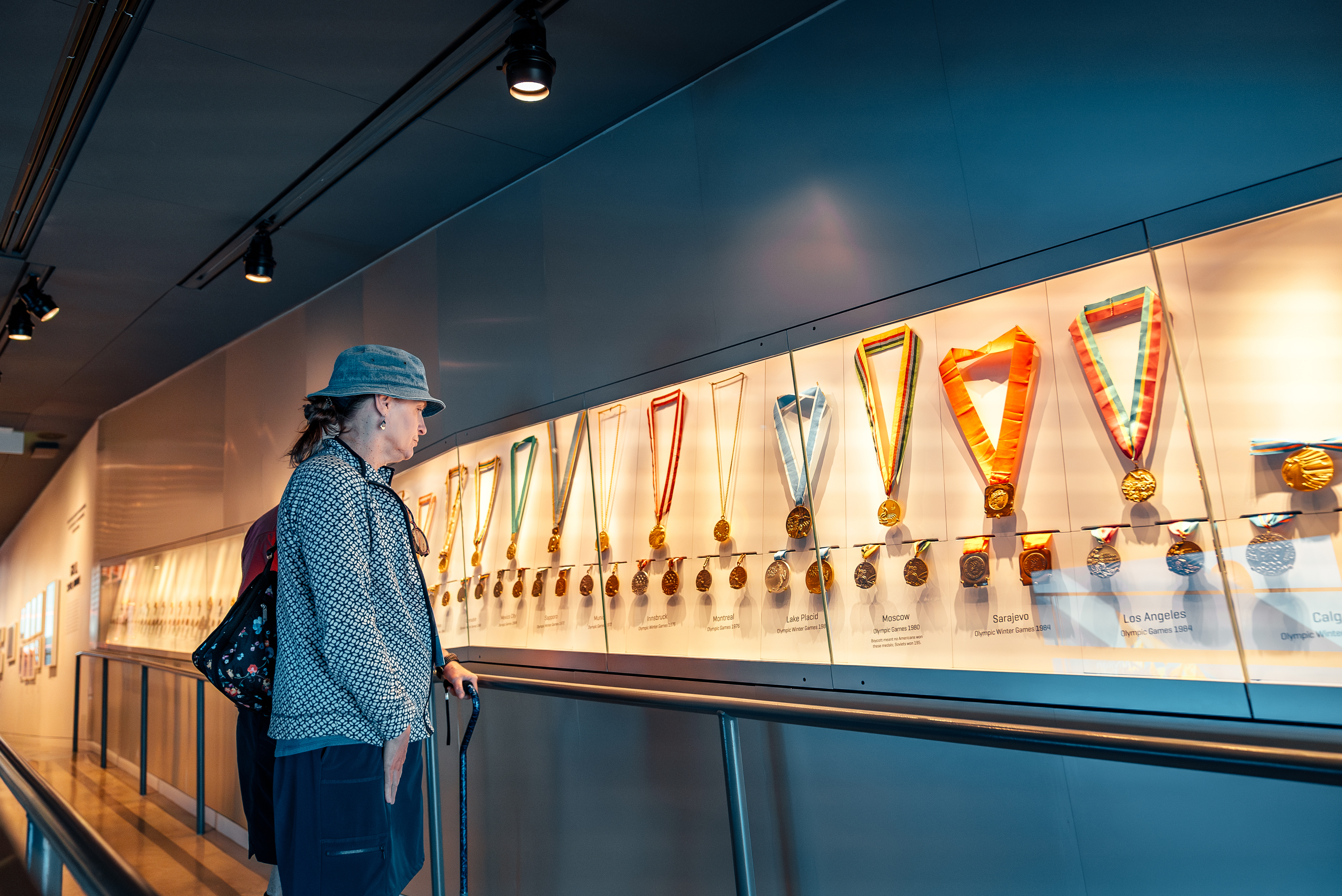 A person admires the US Olympic & Paralympic Museum medals display in Colorado Springs