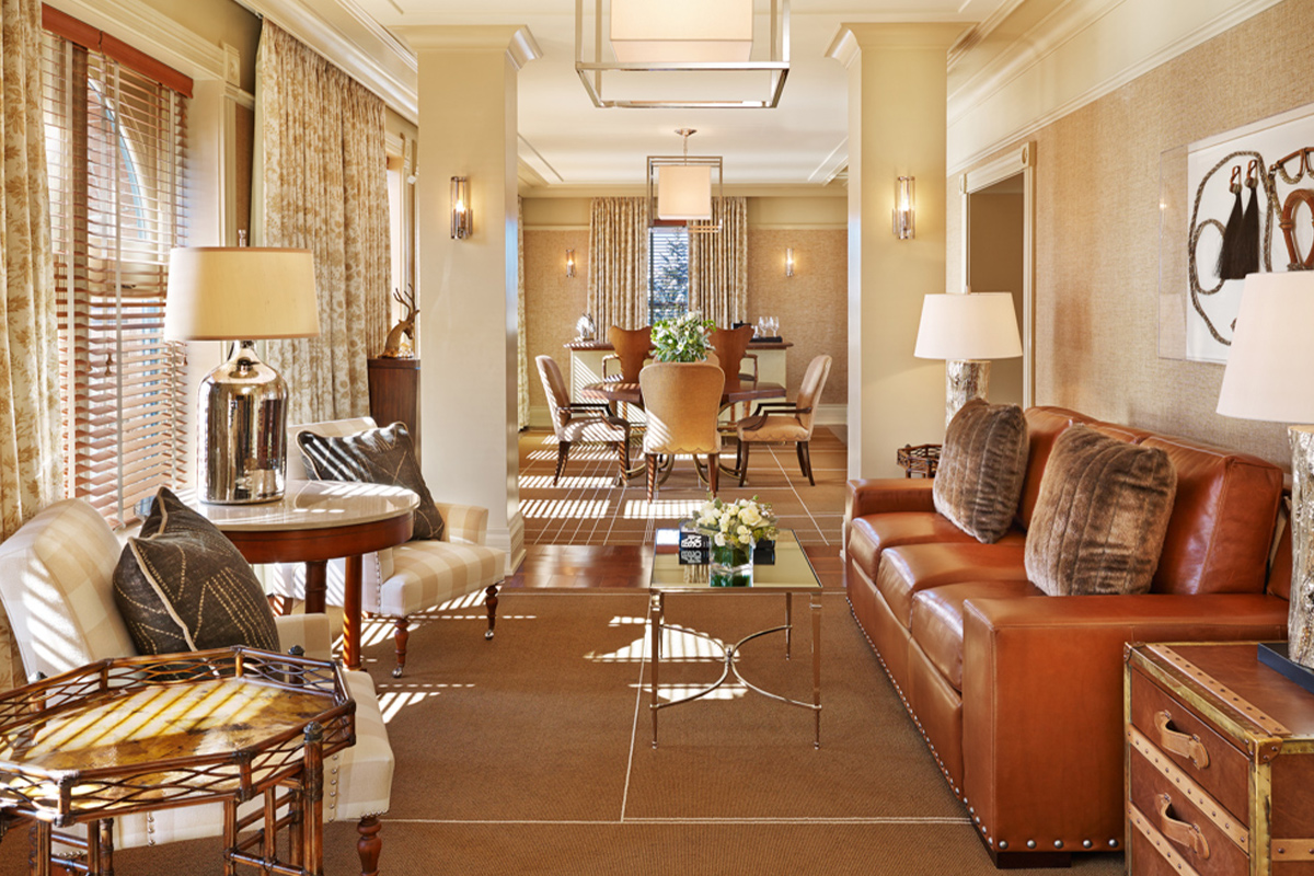 A sleek western-chic-style living room awaits guests staying in the Wheeler Suite at Hotel Jerome in Aspen, Colorado.