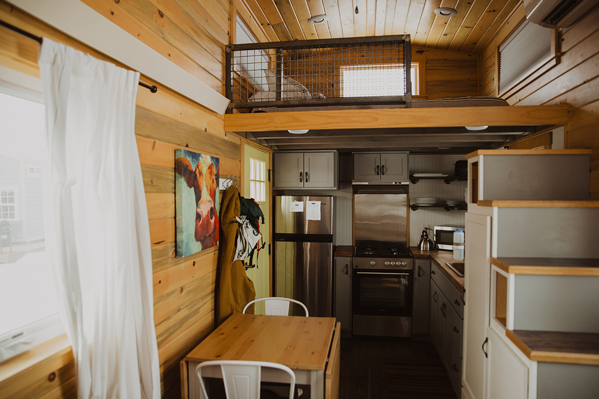 Near Meeker, Colorado, the inside of one of Trail and Hitch's tiny homes features all the necessities, from a loft bed to cooking stove.
