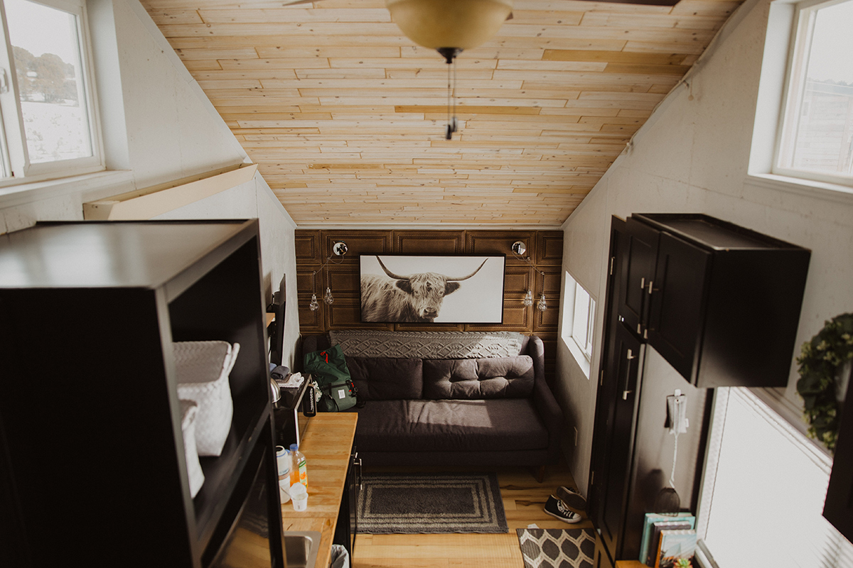 A dark neutral interior welcomes guests to one of the tiny homes at Trail and Hitch in Meeker, Colorado.