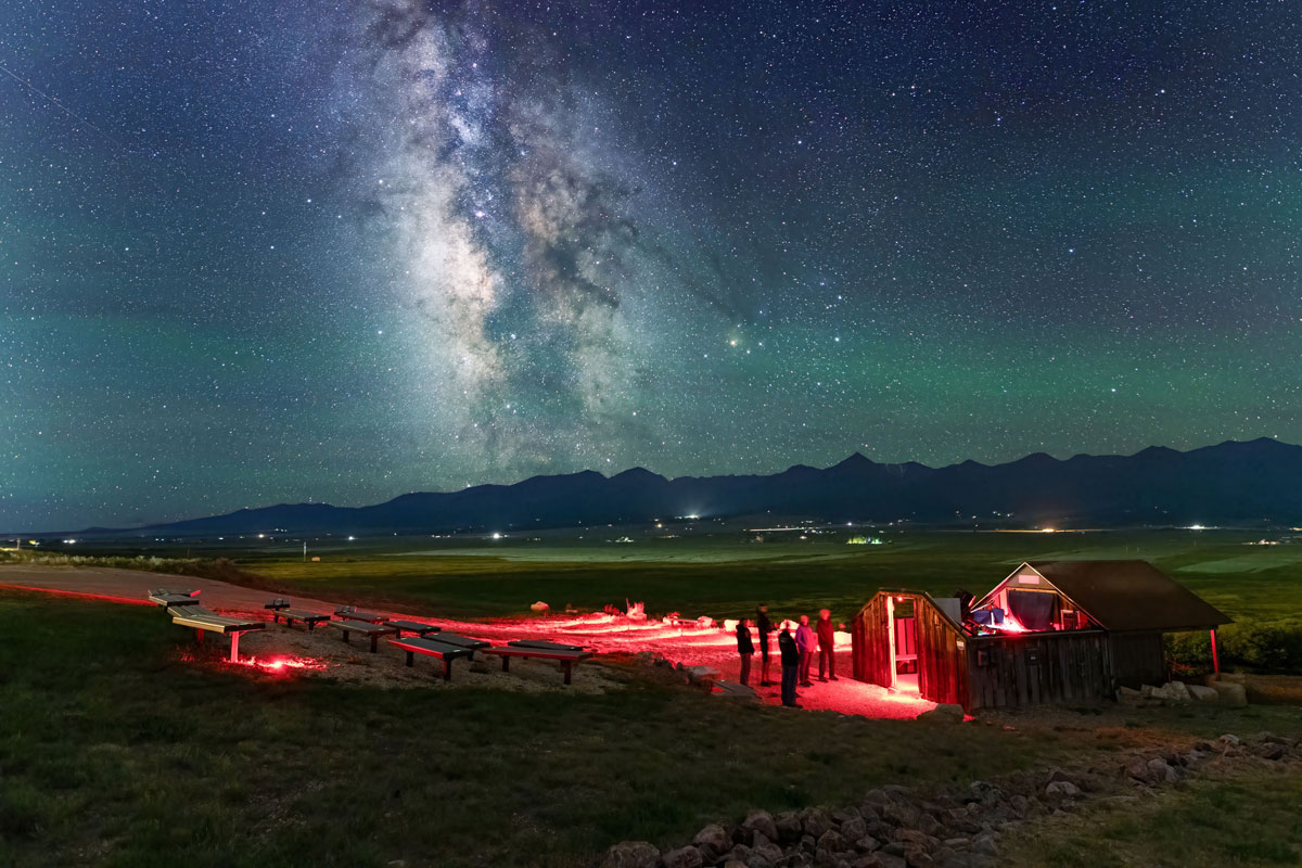 Smokey Jack Observatory at night with sparkling stars in the sky above in Westcliffe, Colorado.