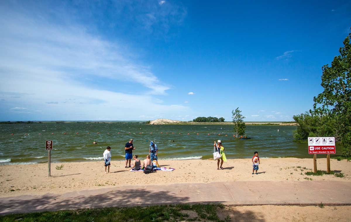 People play games on the beach at North Sterling State Park