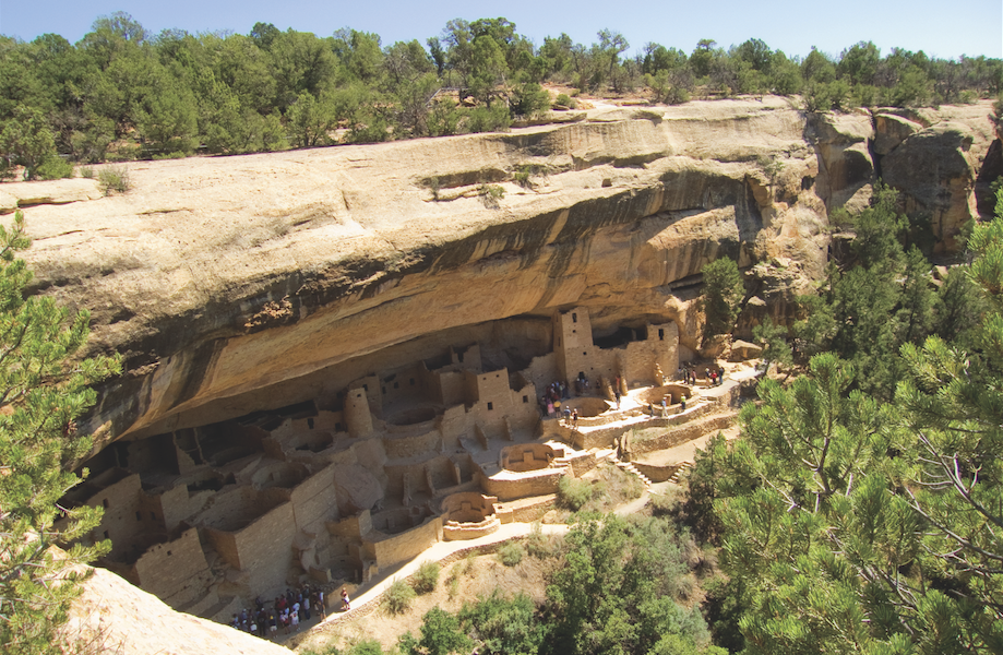 Cave dwellings are carved into a large rock face