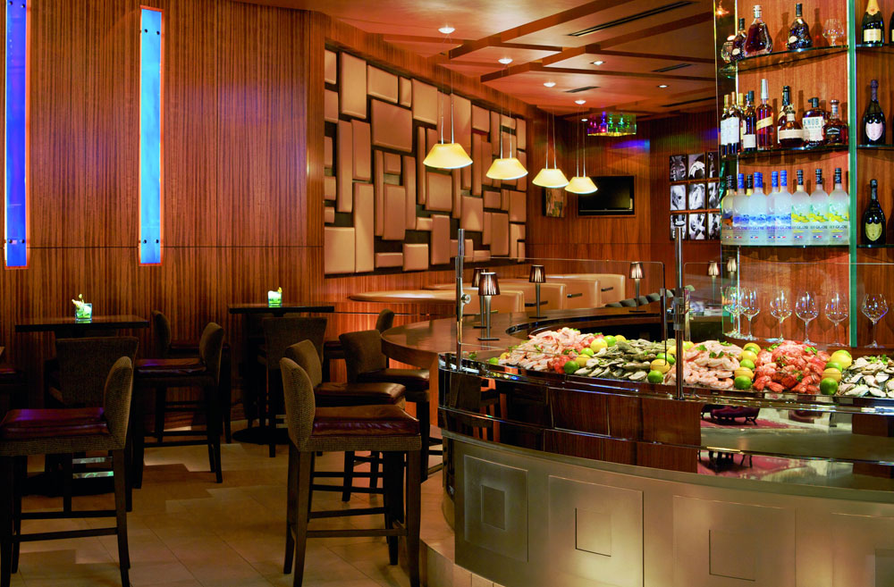 Interior view of a restaurant and bar with soft warm lighting 