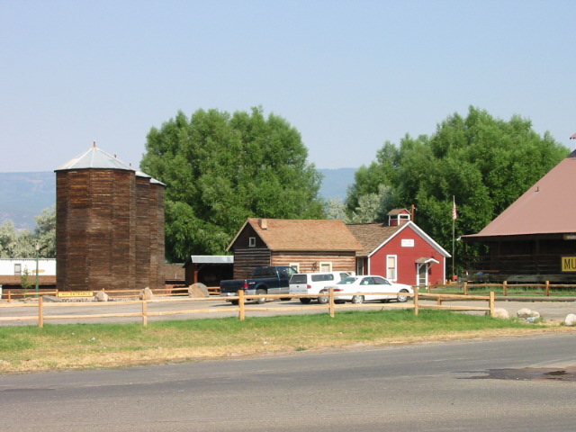 historic silos, peterson cabin, and sand creek schoolhouse welcome you as you arrive at pioneer town photo